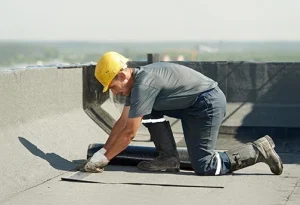 Professional roofer installing flat roofing material for a roofing company SEO campaign in Ohio