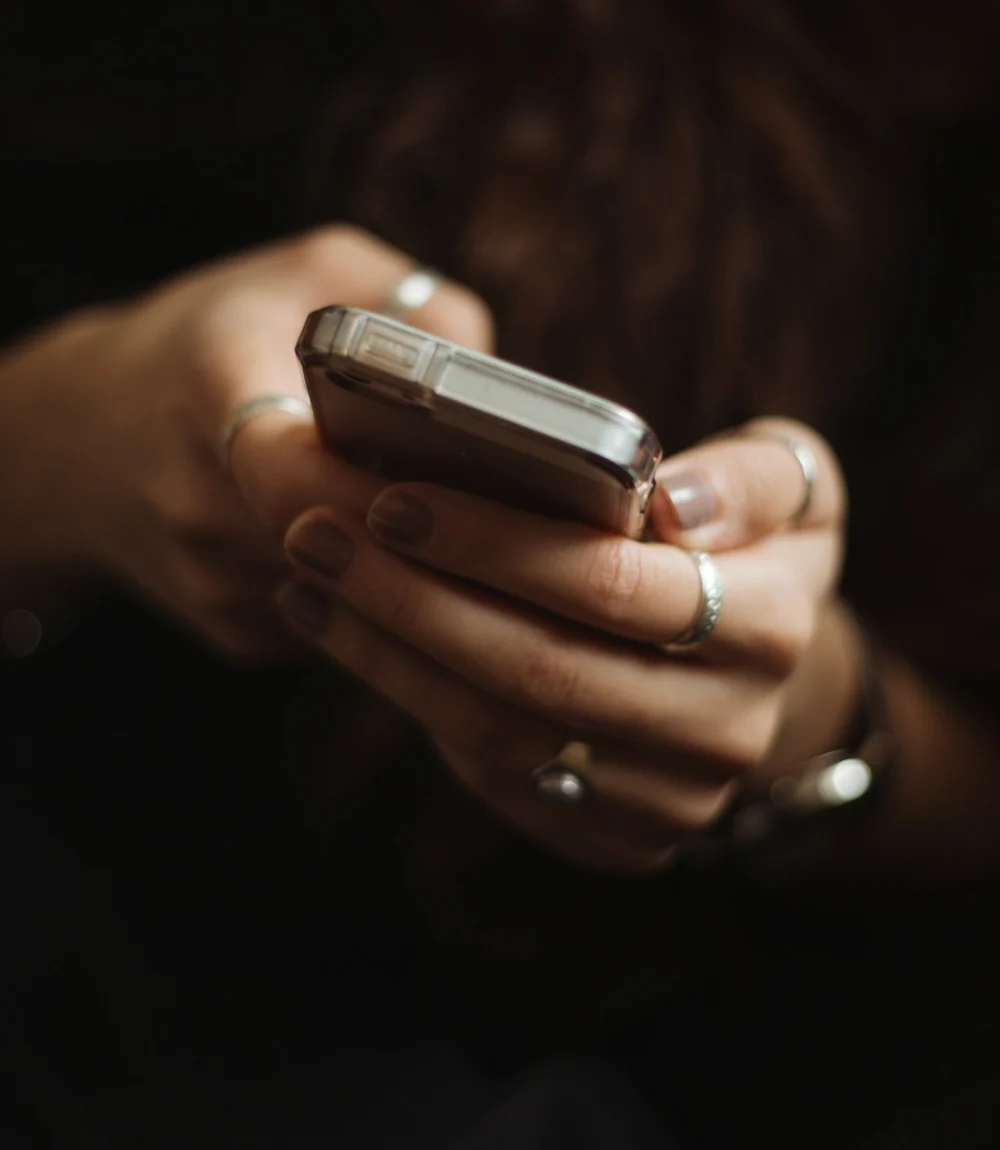 Person using a smartphone to ask a search question