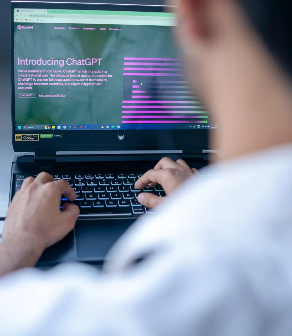 Business owner reviewing AI search results on a laptop
