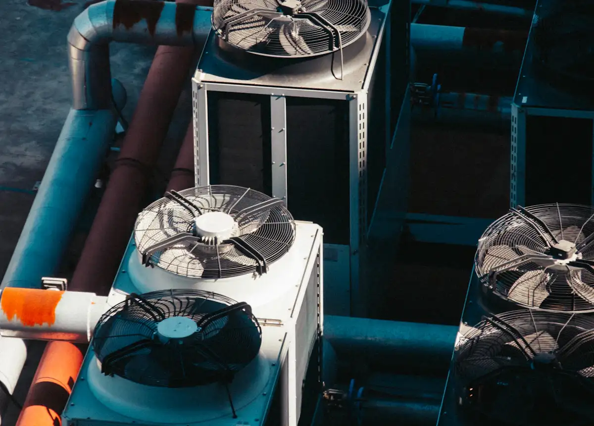 Close-up of outdoor air conditioning condenser units and refrigerant lines