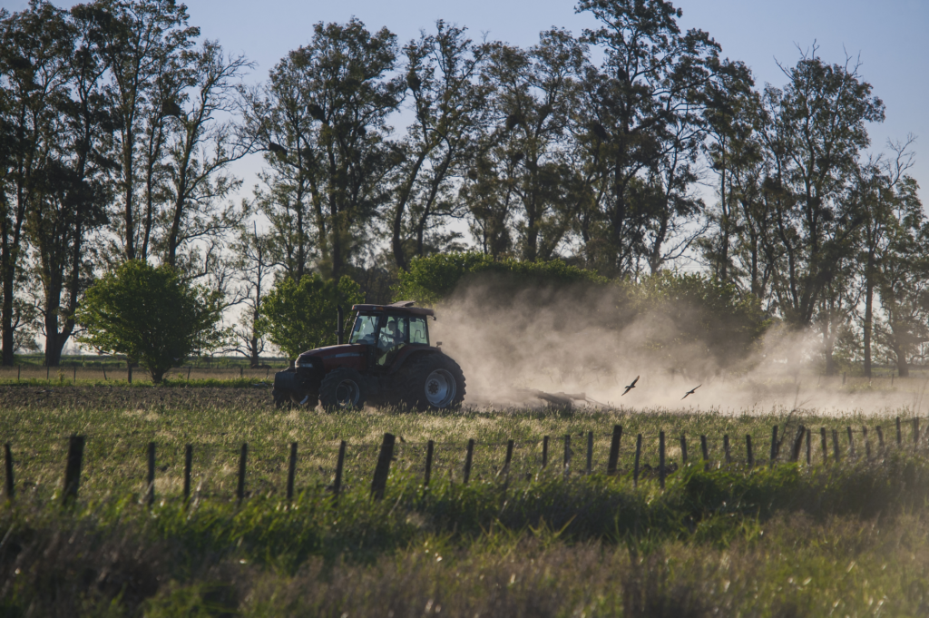 Tractor working in farmland